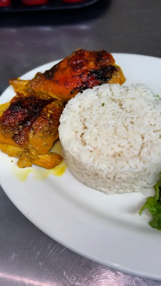 Dominican lunch plate with rice, beans and stewed meat